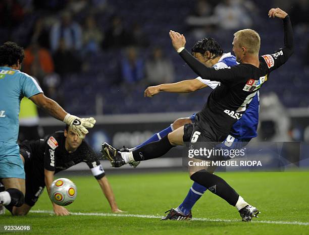 Porto's Argentinian player Ernesto Farias shoots and scores a goal against Academica during their Portuguese league football match at the Dragao...