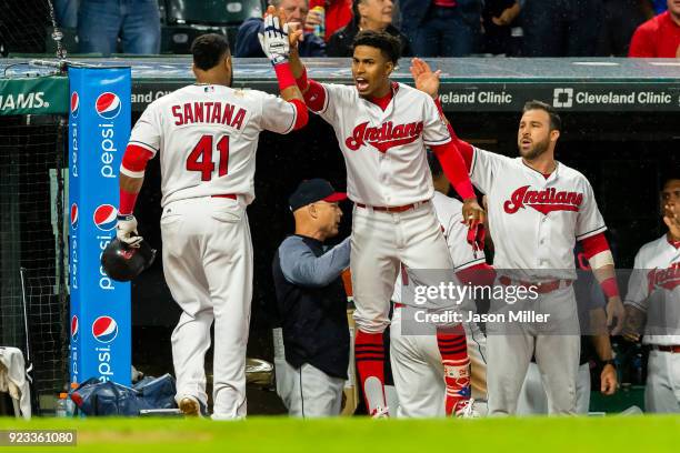 Carlos Santana of the Cleveland Indians celebrates with Francisco Lindor after Santana scores on a hit by Lonnie Chisenhall during the sixth inning...