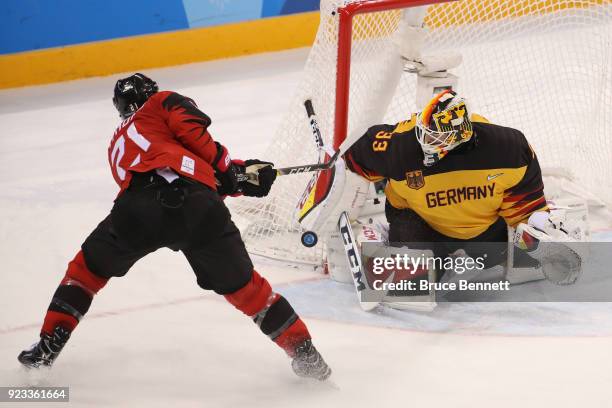 Danny Aus Den Birken of Germany makes a save against Mason Raymond of Canada in the second period during the Men's Play-offs Semifinals on day...