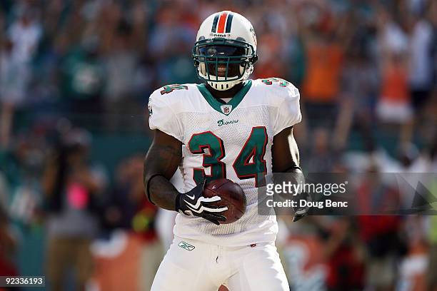 Running back Ricky Williams of the Miami Dolphins celebrates a touchdown run against the New Orleans Saints at Land Shark Stadium on October 25, 2009...