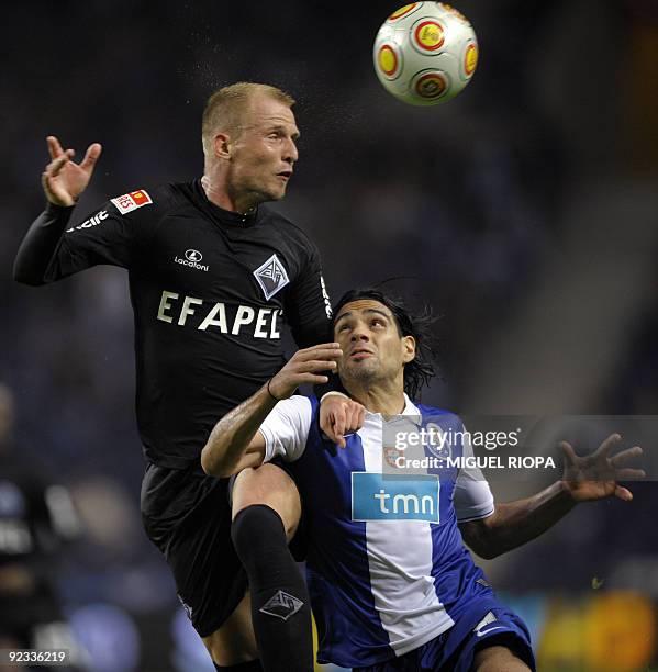 Porto´s Radamel Falcao from Colombia vies with Academica´s Markus Berger from Austria during their Portuguese league football match at the Dragao...