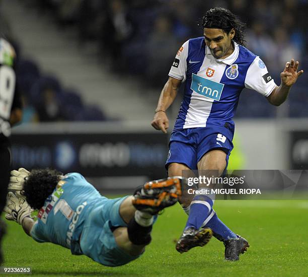 Porto´s Colombian player Radamel Falcao tries to score a goal against Academica´s goalkeeper Rui Nereu during their Portuguese league football match...