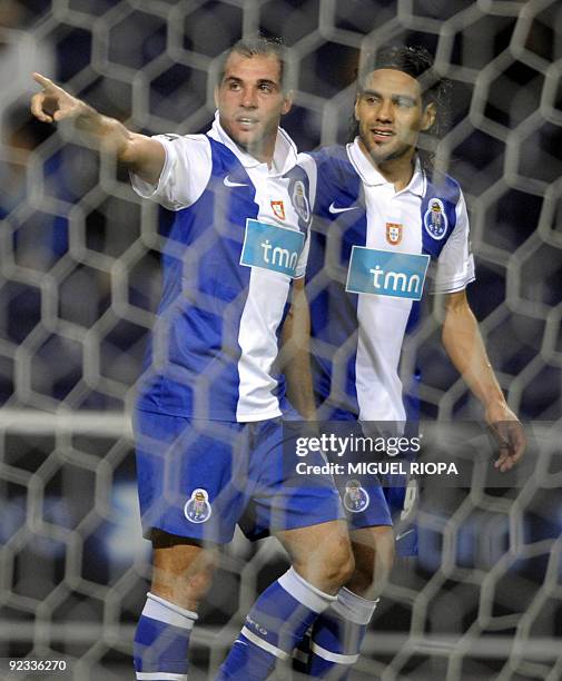 Porto´s Argentinian player Mariano Gonzalez celebrates with teammate Radamel Falcao of Colombia after scoring a goal against Academica during their...