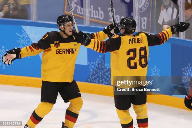 Marcel Goc and Frank Mauer of Germany celebrate after a goal by Mauer in the second period during the Men's Play-offs Semifinals on day fourteen of...