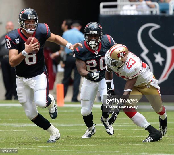 Quarterback Matt Schaub of the Houston Texans scrambles to avoid being tackled by cornerback Marcus Hudson of the San Francisco 49ERS as running back...