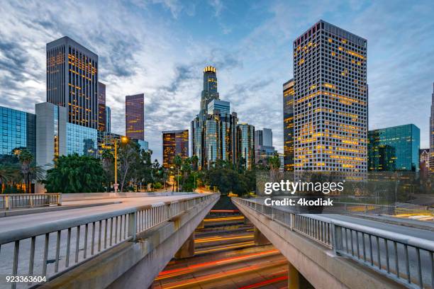 los angeles and traffic at dawn - us bank tower stock pictures, royalty-free photos & images