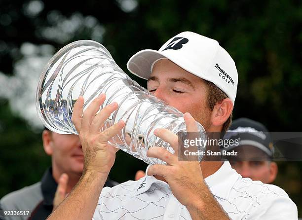 Matt Every kisses the winner's trophy on the 18th green during the final round of the Nationwide Tour Championship at Daniel Island Club on October...