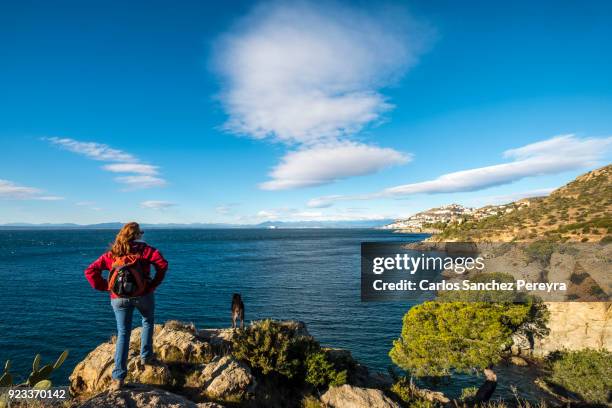 a mature woman in a coastline - cap de creus stockfoto's en -beelden