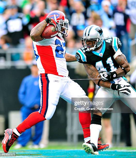 Marshawn Lynch of the Buffalo Bills scores a touchdown against Captain Munnerlyn of the Carolina Panthers at Bank of America Stadium on October 25,...