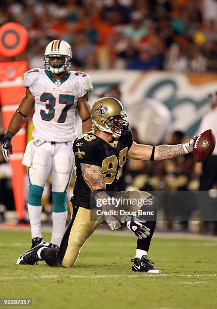 Tight end Jeremy Shockey of the New Orleans Saints celebrates after making a first down reception over safety Yeremiah Bell of the Miami Dolphins at...