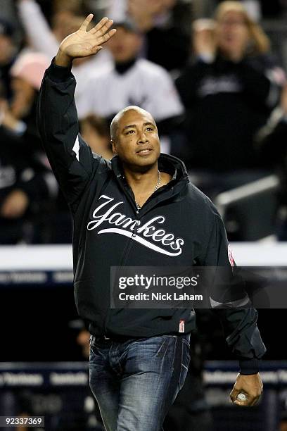 Former New York Yankee Bernie Williams waves as he walks out to throw the opening pitch of Game Six of the ALCS between the New York Yankees and the...