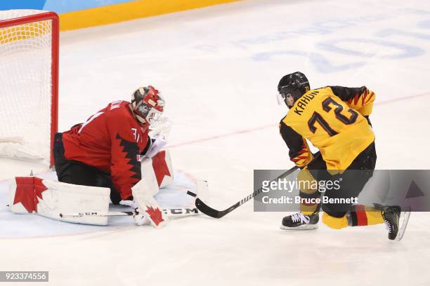 Kevin Poulin of Canada stops a penalty shot by Dominik Kahun of Germany in the third period during the Men's Play-offs Semifinals on day fourteen of...