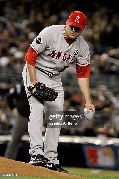 Joe Saunders of the Los Angeles Angels of Anaheim uses a rosin bag before pitching against the New York Yankees in the bottom of the second inning of...