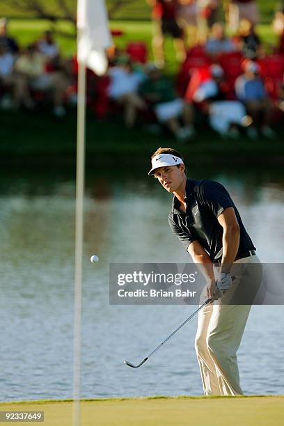 Jamie Lovemark chips off the water's edge onto the 18th green to stay alive on the first hole of a two-hole playoff during the fourth round of the...