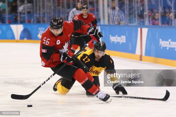 Maxim Noreau of Canada skates against Marcus Kink of Germany in the third period during the Men's Play-offs Semifinals on day fourteen of the...