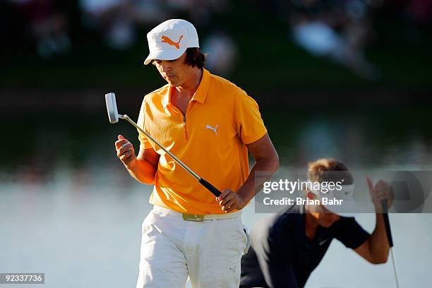 Rickie Fowler walks away from his putt on the 18th green, the first green of a two-hole playoff, during the fourth round of the 2009 Frys.com Open on...