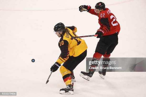 Christian Ehrhoff of Germany controls the puck against Eric O'Dell of Canada during the Men's Play-offs Semifinals on day fourteen of the PyeongChang...