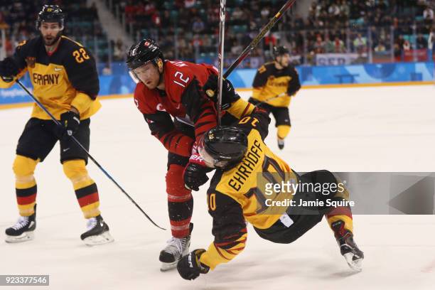 Rob Klinkhammer of Canada collides with Christian Ehrhoff of Germany during the Men's Play-offs Semifinals on day fourteen of the PyeongChang 2018...