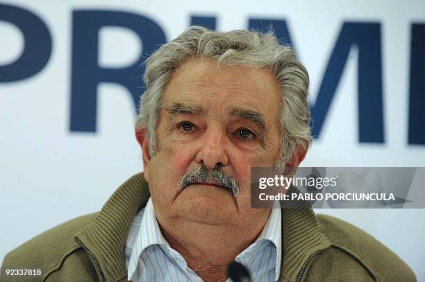 Uruguayan presidential candidate for the ruling Frente Amplio party, former guerrilla Jose Mujica listens to a question during a press conference...