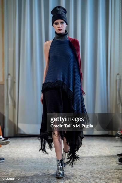 Model walks the runway at the Grinko show during Milan Fashion Week Fall/Winter 2018/19 on February 23, 2018 in Milan, Italy.