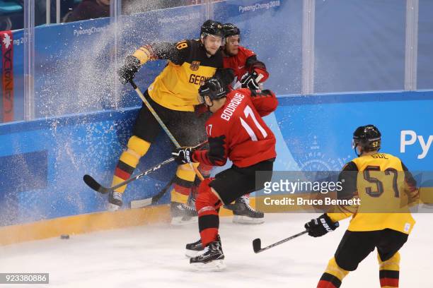 Frank Hordler of Germany collides with Mat Robinson of Canada during the Men's Play-offs Semifinals on day fourteen of the PyeongChang 2018 Winter...
