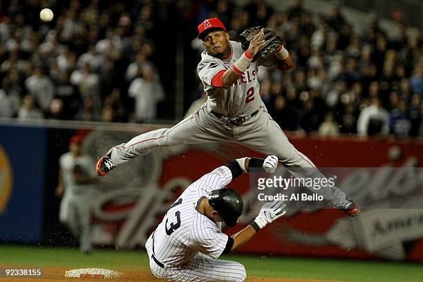 Alex Rodriguez of the New York Yankees is forced out at second base as Erick Aybar of the Los Angeles Angels of Anaheim throws to first base for a...