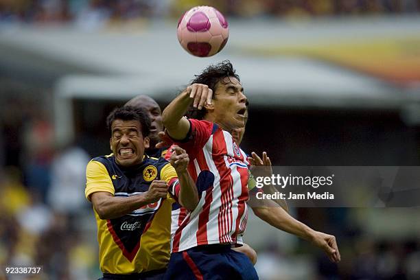 Pavel Pardo of America and Omar Bravo of Chivas during their match in the 2009 Opening tournament, the closing stage of the Mexican Football League,...