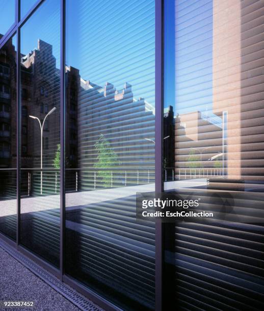 reflection in window of office building at hafencity, hamburg - facade blinds stock pictures, royalty-free photos & images