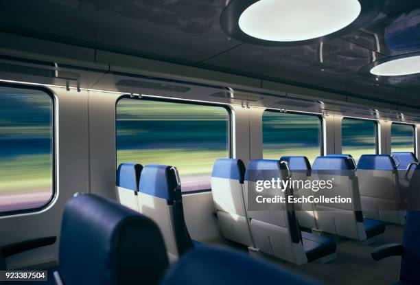 traveling at high speed by modern intercity train - bullet trains stockfoto's en -beelden