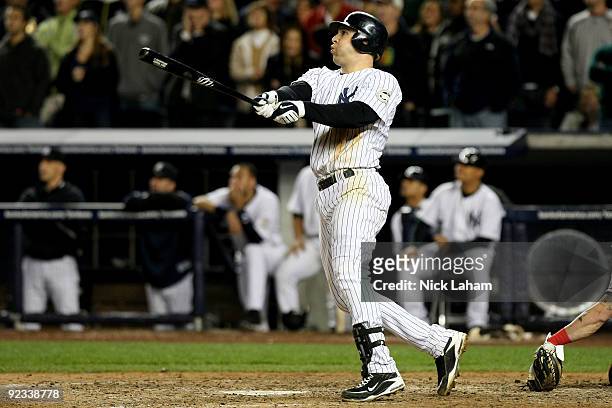 Mark Teixeira of the New York Yankees hits a sacrfice fly to centerfield in the bottom of the eighth inning against the Los Angeles Angels of Anaheim...