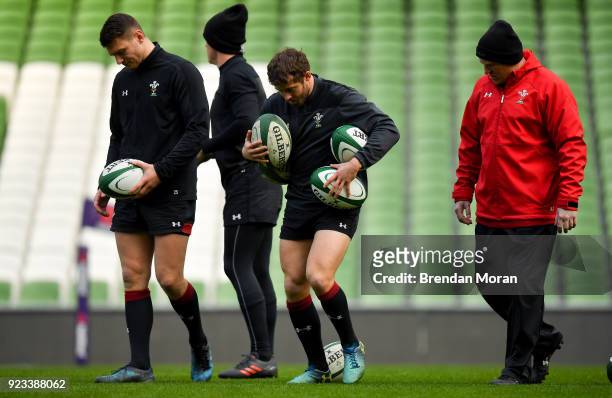 Dublin , Ireland - 23 February 2018; Dan Biggar, left, and Leigh Halfpenny with kicking coach Neil Jenkins during the Wales Rugby captain's run at...
