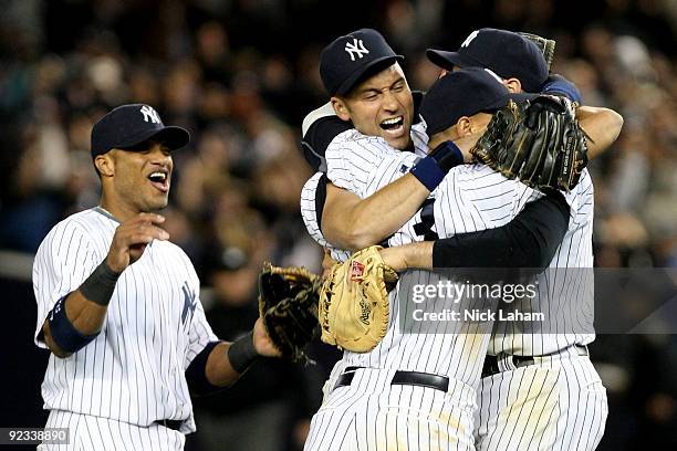 Robinson Cano, Derek Jeter, Mark Teixeira and Alex Rodriguez of the New York Yankees celebrate their 5-2 victory over the Los Angeles Angels of...