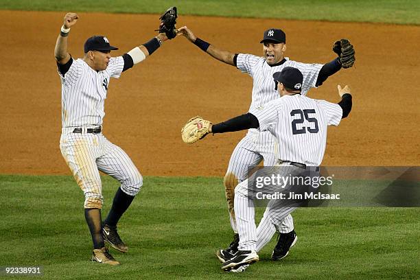 Alex Rodriguez, Derek Jeter and Mark Teixeira of the New York Yankees celebrate their 5-2 victory over the Los Angeles Angels of Anaheim at the end...