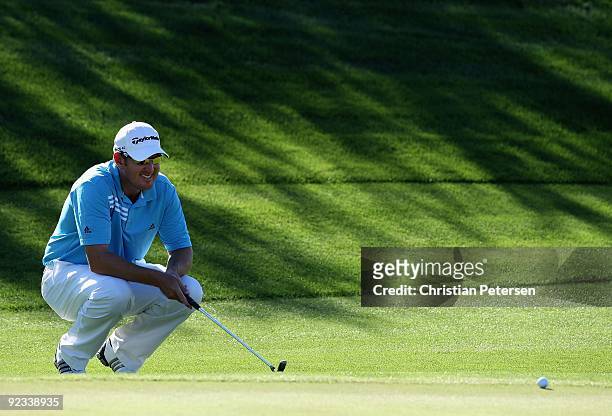 Greg Owen of England lines up a putt on the 14th hole green during the third round of the Frys.com Open at Grayhawk Golf Club on October 24, 2009 in...