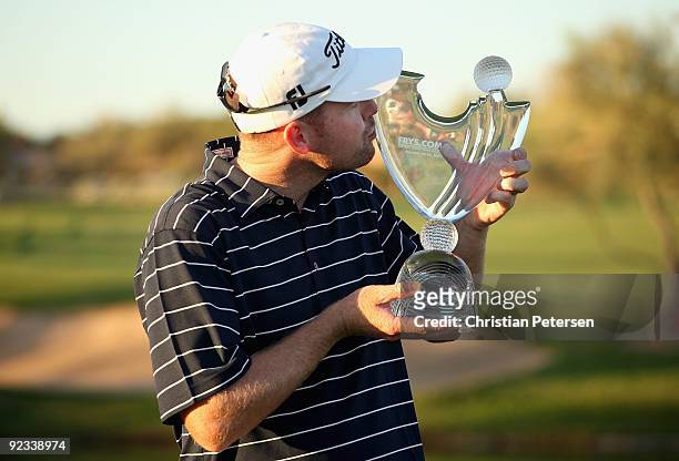 Troy Matteson kisses the winner's trophy after winning the Frys.com Open in a fourth round 2 hole playoff at Grayhawk Golf Club on October 25, 2009...