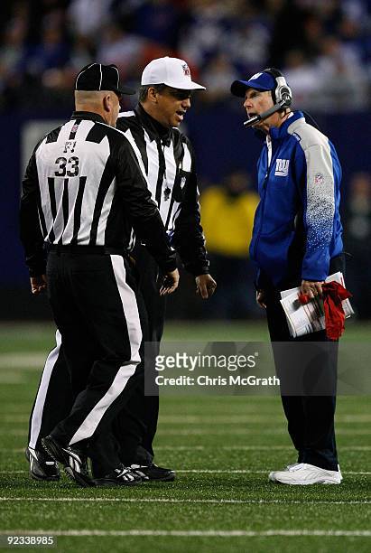 Head coach Tom Coughlin of the New York Giants talks with referees during the first half against the Arizona Cardinals on October 25, 2009 at Giants...