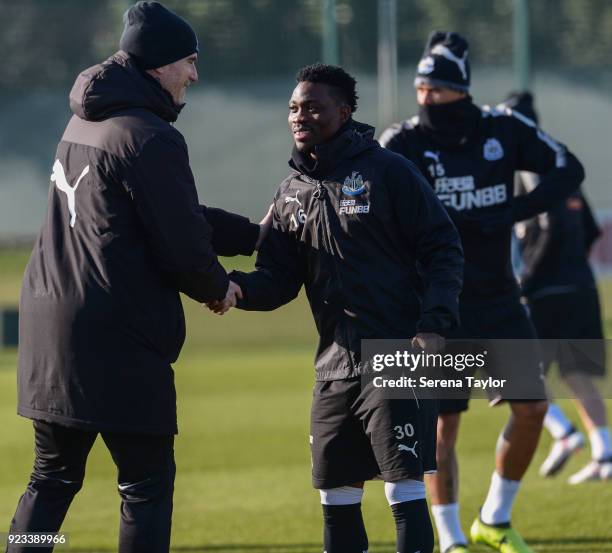 Christian Atsu shakes hands with Newcastle United First Team Coach Mikel Antia during the Newcastle United Training session at the Newcastle United...