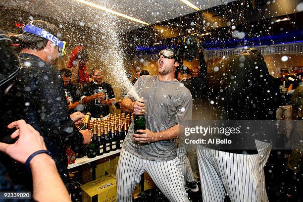 Joba Chamberlain of the New York Yankees sprays champagne while celebrating their 5-2 victory over the Los Angeles Angels of Anaheim in Game Six of...