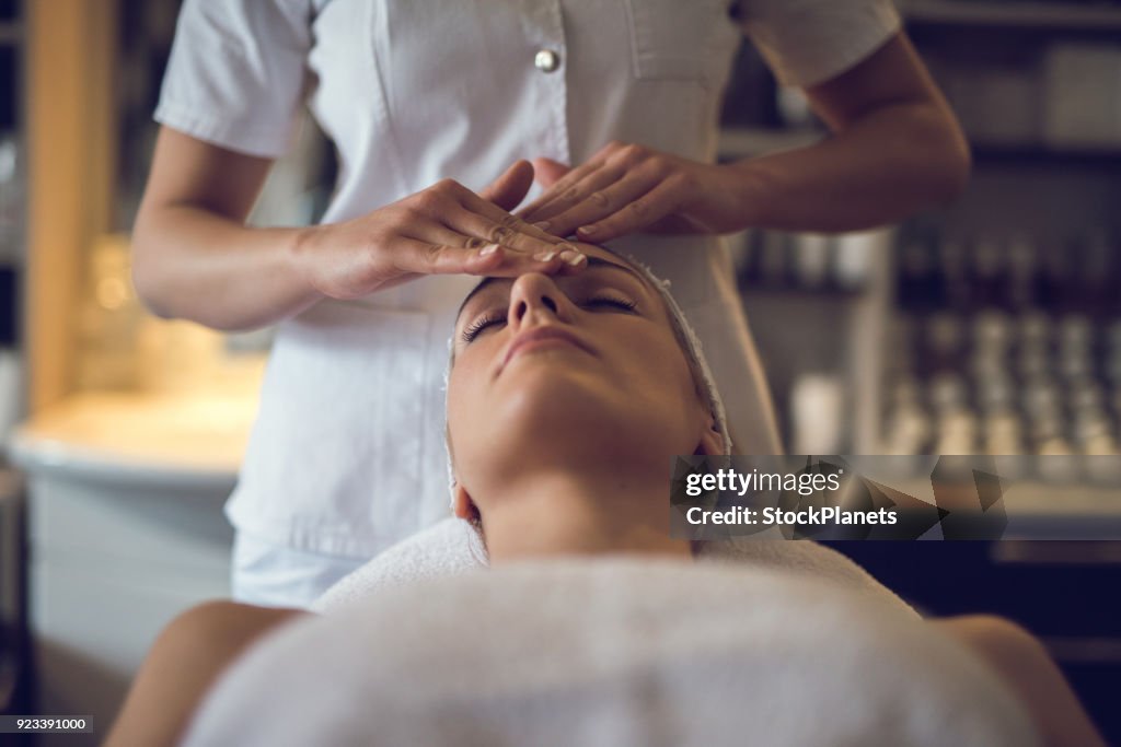 Close up young women enjoying head massage