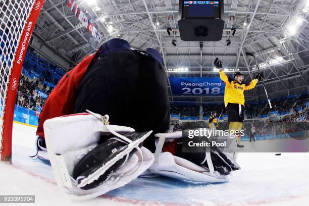 Frank Mauer of Germany celebrates a second period goal against Kevin Poulin of Canada during the Men's Play-offs Semifinals on day fourteen of the...