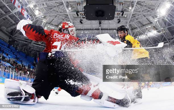 Kevin Poulin of Canada defends against Marcus Kink of Germany during the Men's Play-offs Semifinals on day fourteen of the PyeongChang 2018 Winter...
