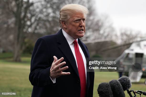 President Donald Trump speaks to members of the media prior to his departure from the South Lawn of the White House February 23, 2018 in Washington,...