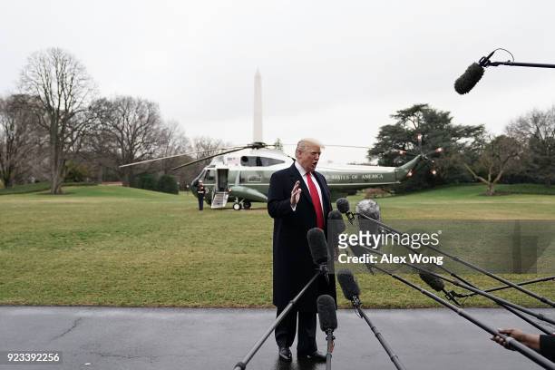 President Donald Trump speaks to members of the media prior to his departure from the South Lawn of the White House February 23, 2018 in Washington,...