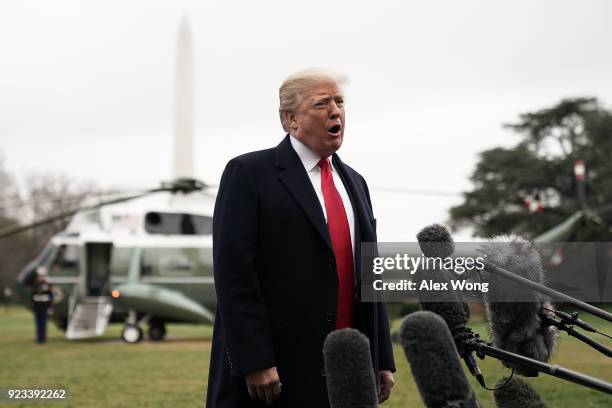 President Donald Trump speaks to members of the media prior to his departure from the South Lawn of the White House February 23, 2018 in Washington,...