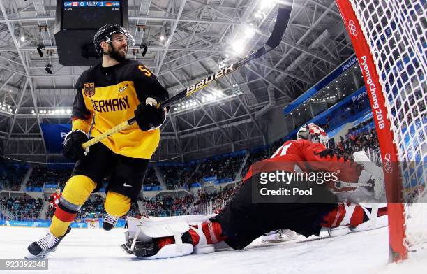 Felix Schutz of Germany celebrates a goal by Matthias Plachta of Germany in the second period against Kevin Poulin of Canada during the Men's...