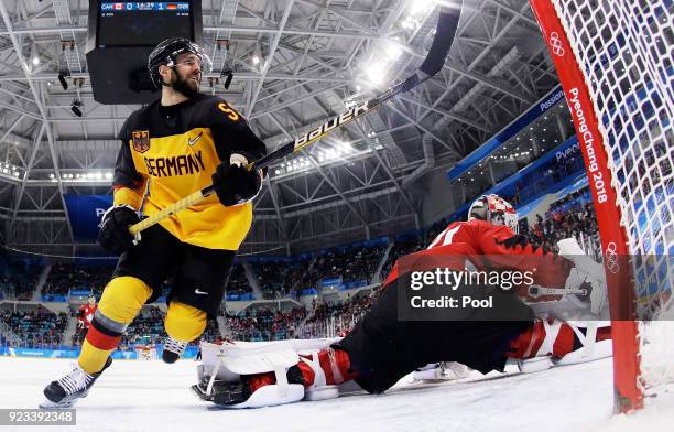 Felix Schutz of Germany celebrates a goal by Matthias Plachta of Germany in the second period against Kevin Poulin of Canada during the Men's...