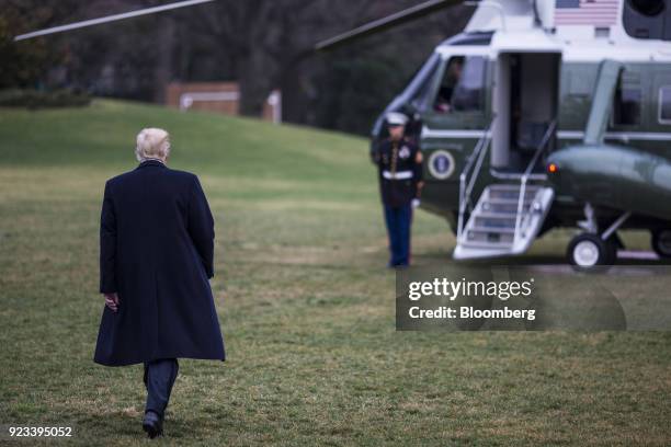 President Donald Trump walks on the South Lawn of the White House towards Marine One to depart for the Conservative Political Action Conference in...