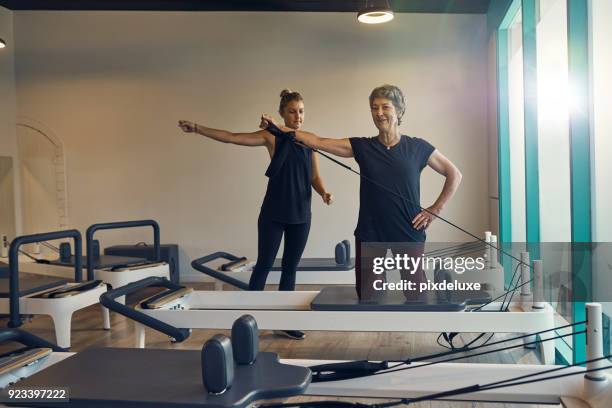 pilates is my happy hour - reformer stock pictures, royalty-free photos & images