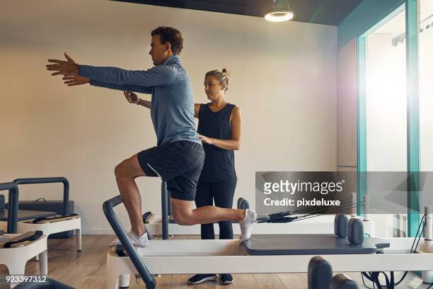 physical fitness comes first - reformer stock pictures, royalty-free photos & images
