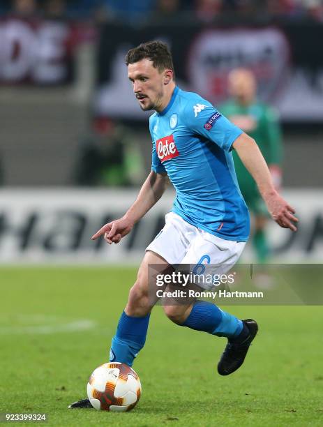 Mario Rui of Napoli runs with the ball during the UEFA Europa League Round of 32 match between RB Leipzig and Napoli at the Red Bull Arena on...